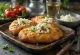 Tiganopsomo s feto in peteršiljem, postrežen s svežim kruhom in hrustljavim feta sirom.